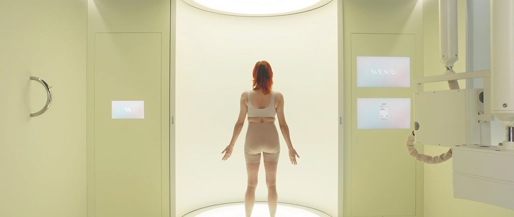 a woman in a white underwearsuit standing in a room