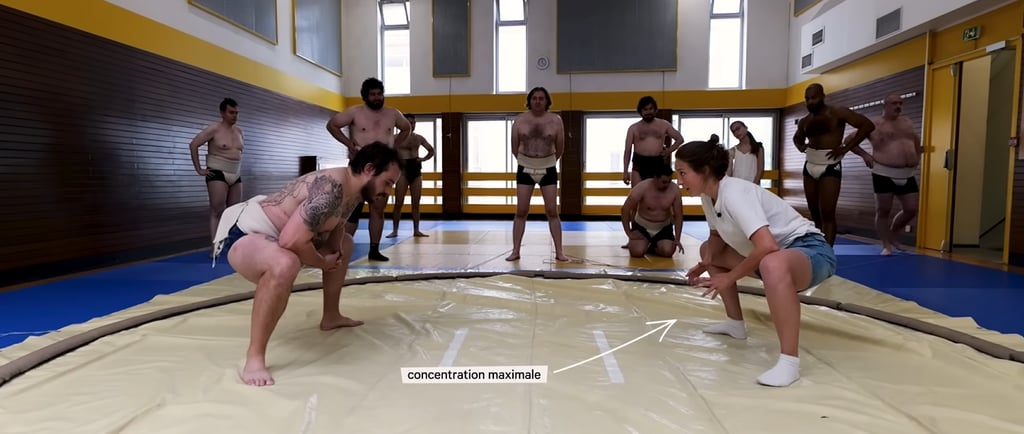 1 homme face 1 femme, sur un dohyo en position de squat. Un encadré "concentration maximale" pointe vers la femme. Les Echos