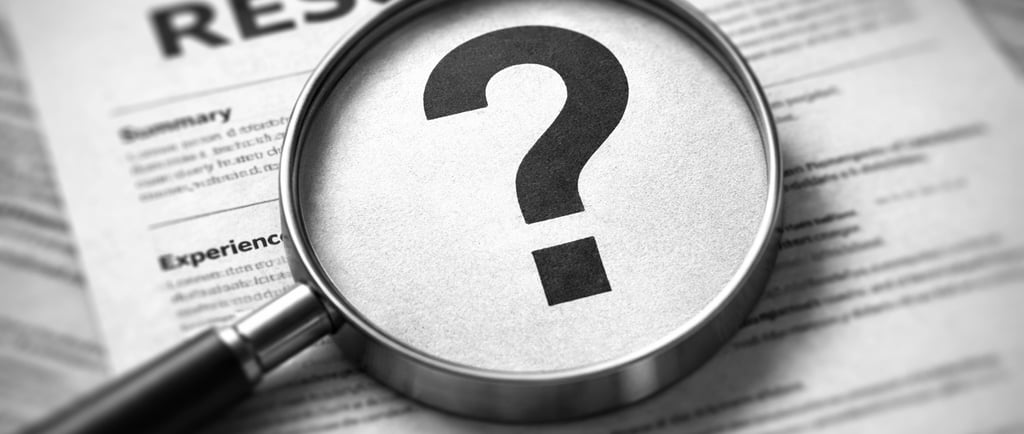 a magnifying glass scaning a resume but it can't find a keyword and shows an interrogation mark