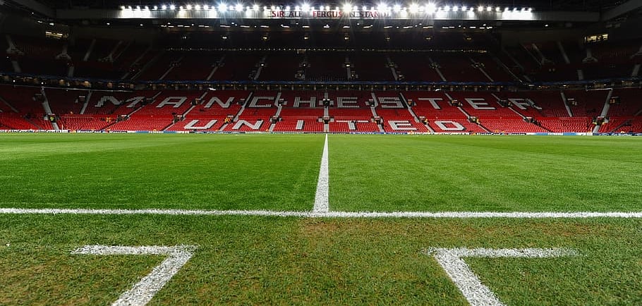 Floodlights lit at Old Trafford at the half-way line