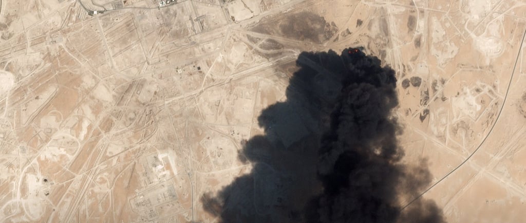 A smoke plume rises from a Saudi refinery after a missile hit in 2019.