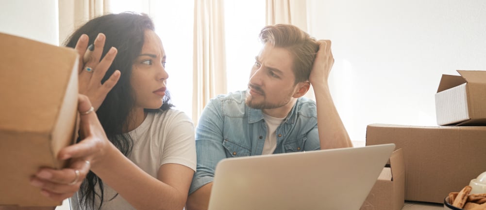couple researching prices and arguing what if they under price their highlands ranch home for sale