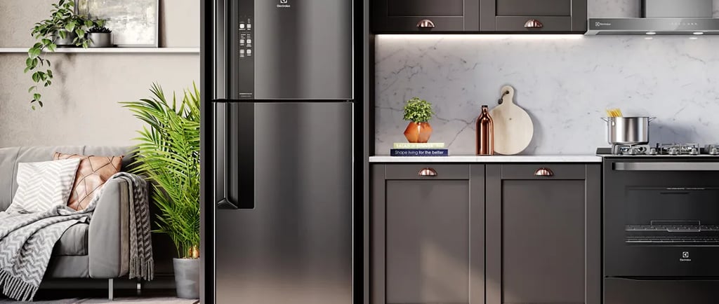 a kitchen with a refrigerator and a couch