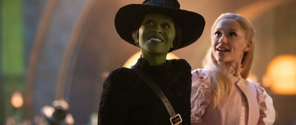 a woman dressed as a witch with a witch costume