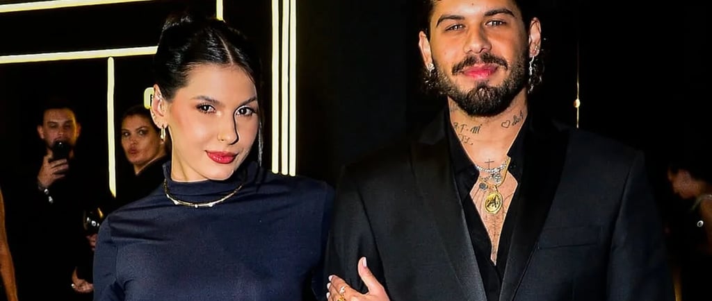 a man and woman standing next to each other