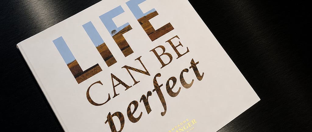 Champagne Bollinger coffee table book on a glossy black surface, creating a refined luxury lifestyle scene.