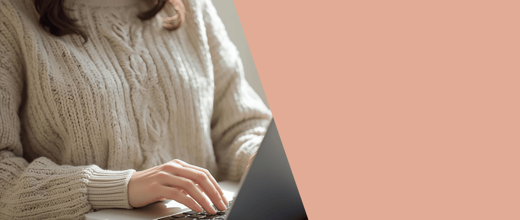 a woman sitting on a couch using a laptop