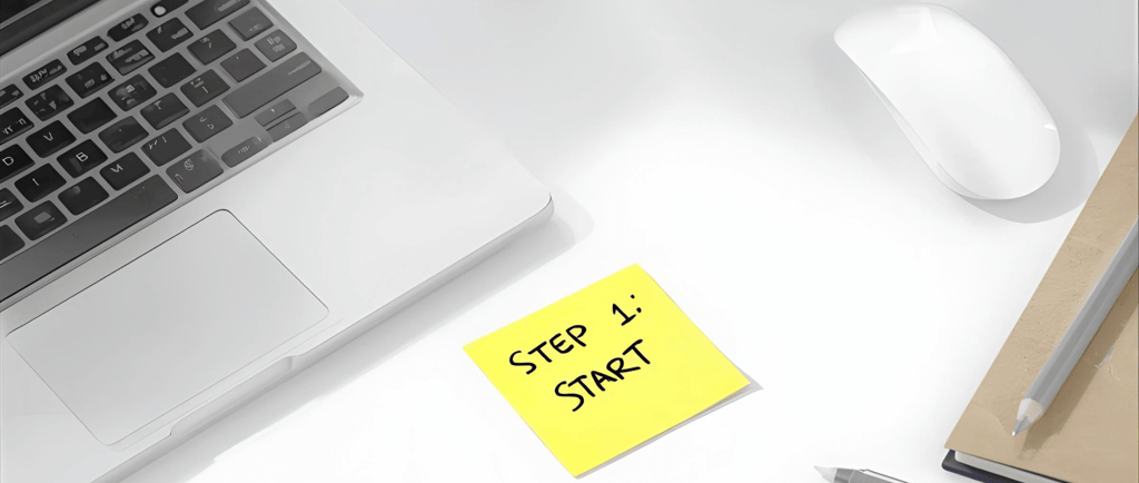 a laptop computer and a keyboard on a desk