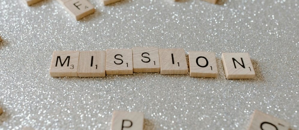 a wooden block with the words mission mission written on it