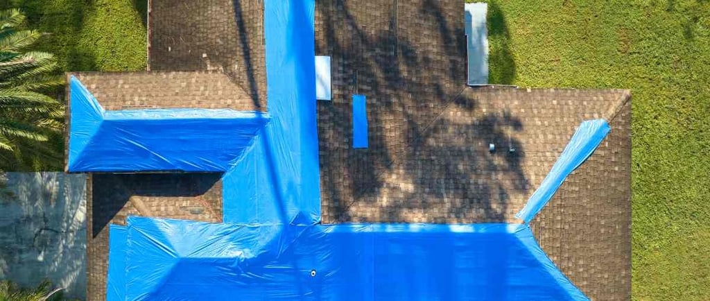 Roof tarp exclusion insurance homeowners claim aerial view
