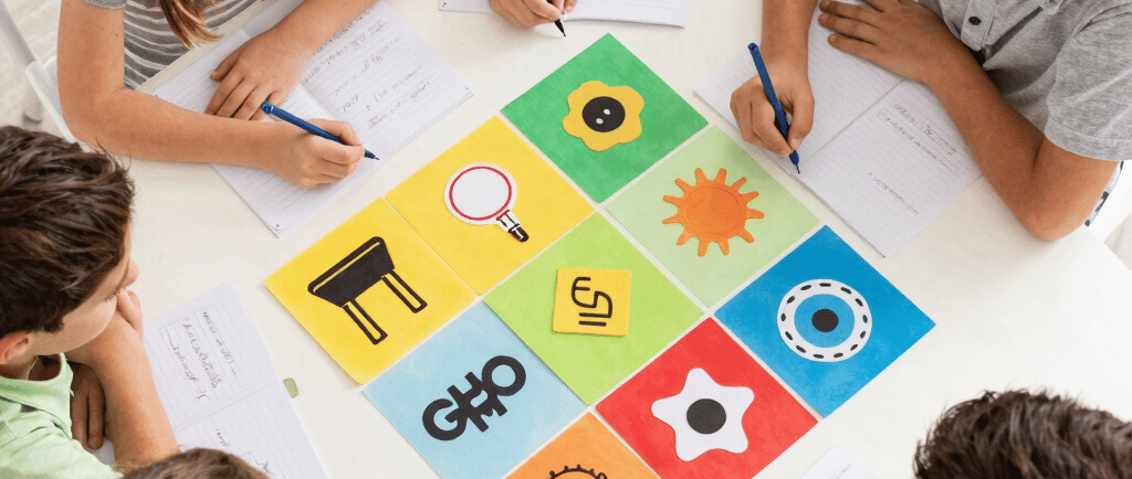 Hands covered in paint mixing colors on canvas