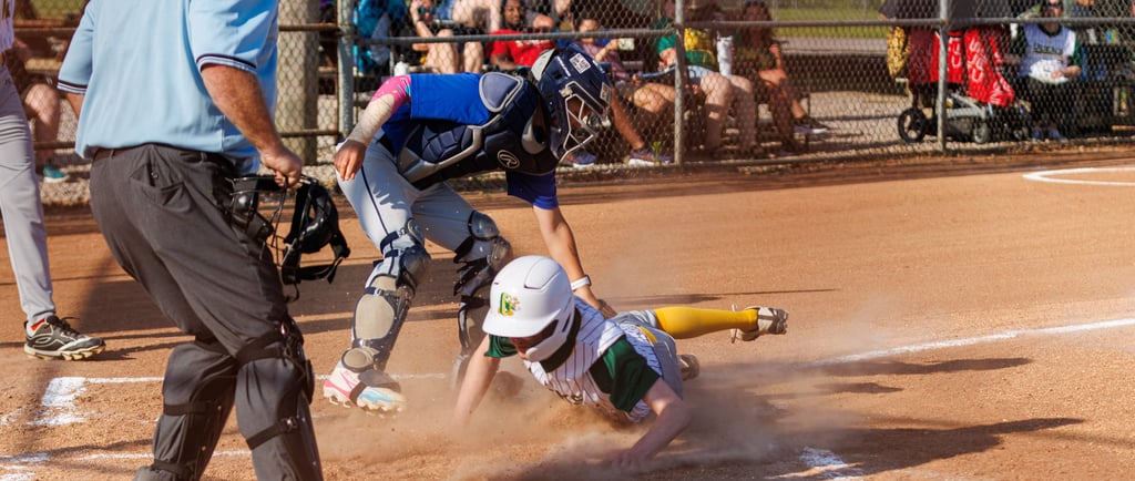 Baseball Player slides into home at Rineyville Ball Park. Photo by William Gore Photography