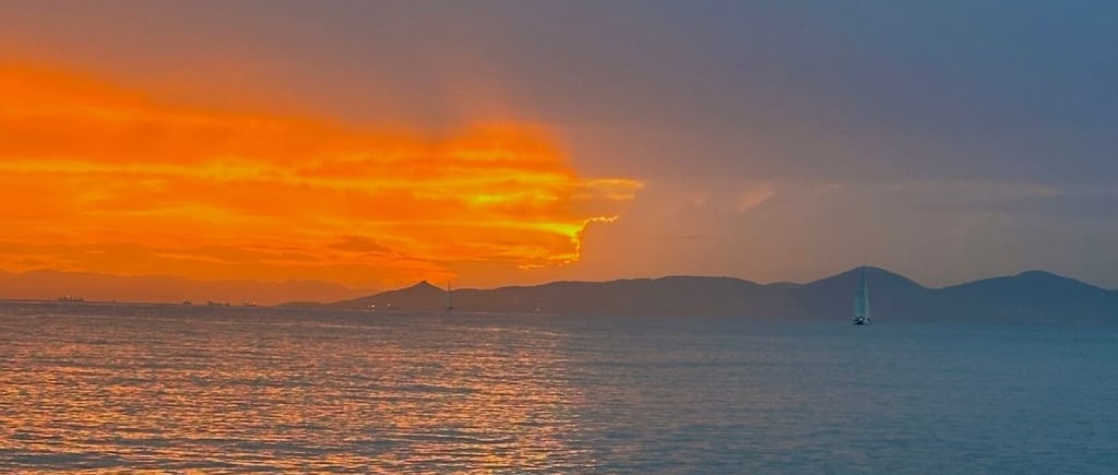 Sunset over the sea symbolizing hope and debt reform in Finland