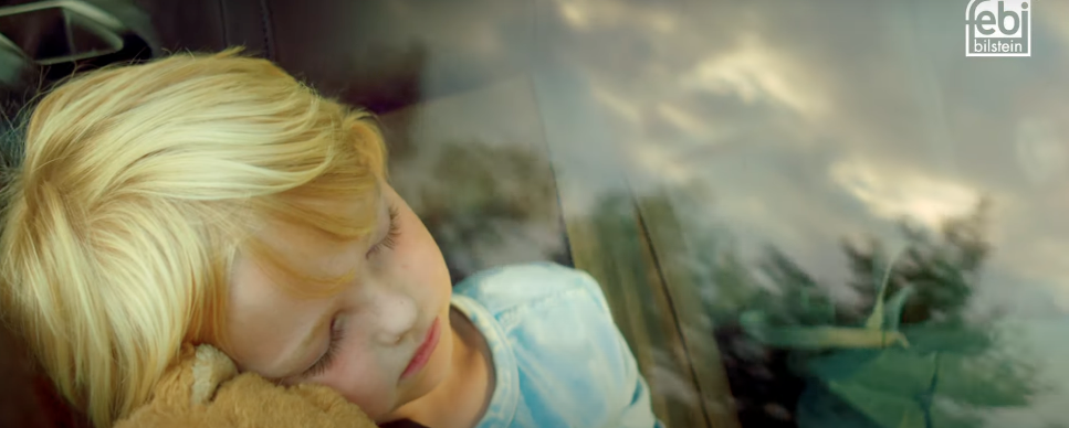 a young boy is holding a teddy bear