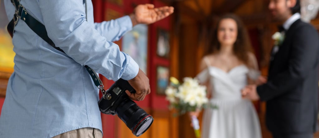 a man in a suit and tie is holding a camera