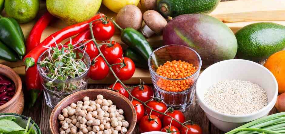 selection of plant based fruit, beans, vegetables, lentils