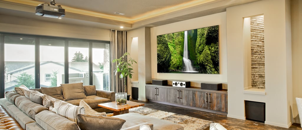 Modern home theater with a custom projection screen and ceiling-mounted projector.