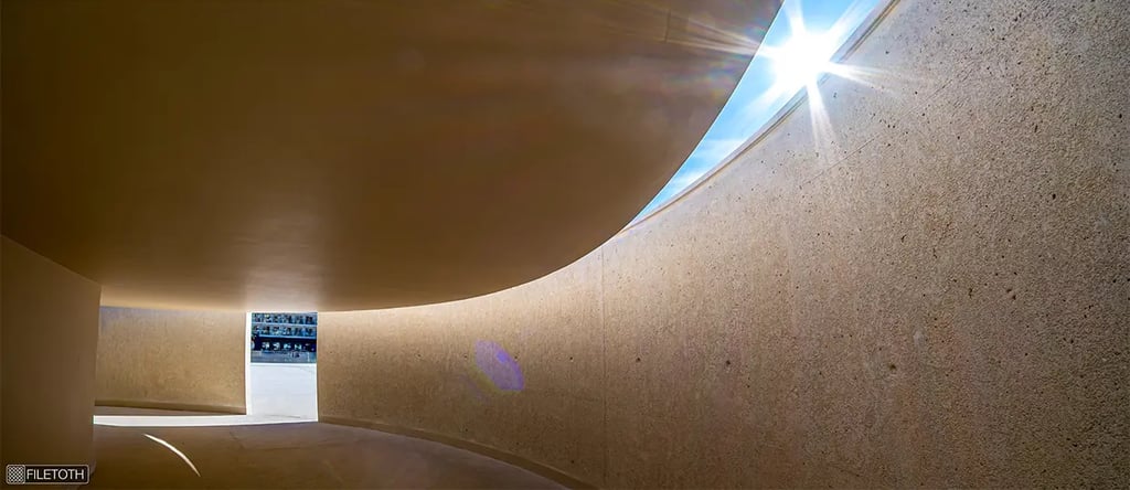 Daylight shifting through the cruise terminal’s passage by Carrilho, creating warm tones that turn transit into calm.