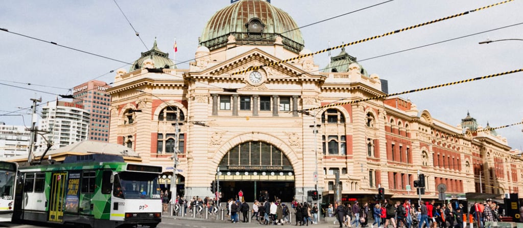 a bus is parked in front of a large building