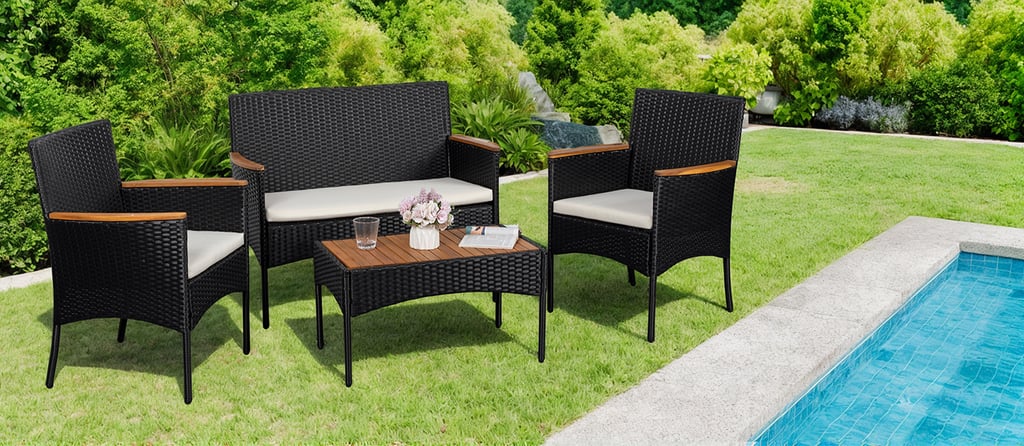 Stylish outdoor patio conversation set with black rattan and soft cushions