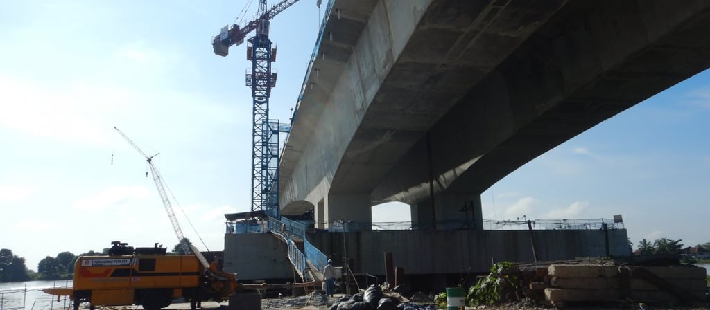 a crane is being built over a bridge