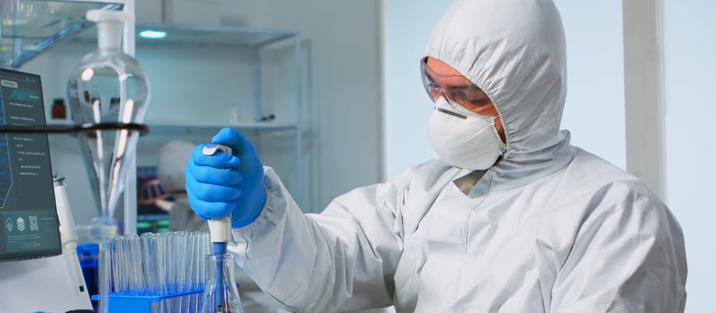 Scientist in a laboratory using a pipette in experiments.