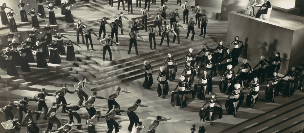 Overhead three‑quarter shot of Gold Diggers of 1935 “Lullaby of Broadway” with dancers in grouped fo
