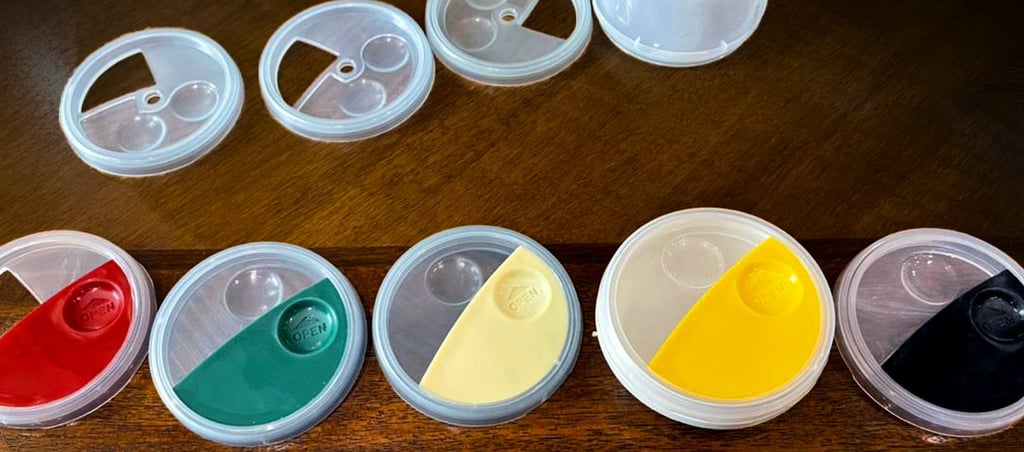Injection molded disposable sauce containers in various colors, designed by Koorosh Shojaei, 1