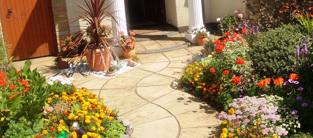 Curvey winding path, circle kits paving slabs weaving through lots of beautiful plants & flowers