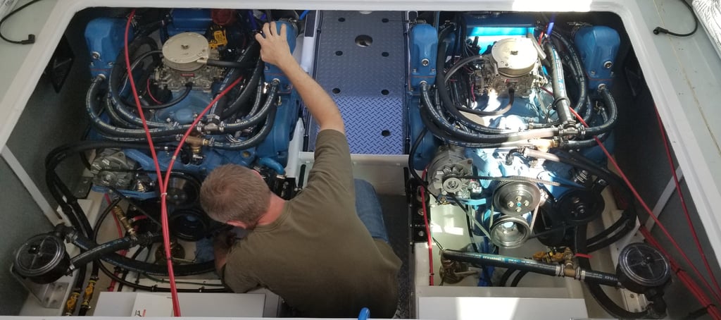 man working in engine room of boat