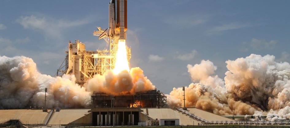 A rocket ship taking off representing fast time to value in saas.