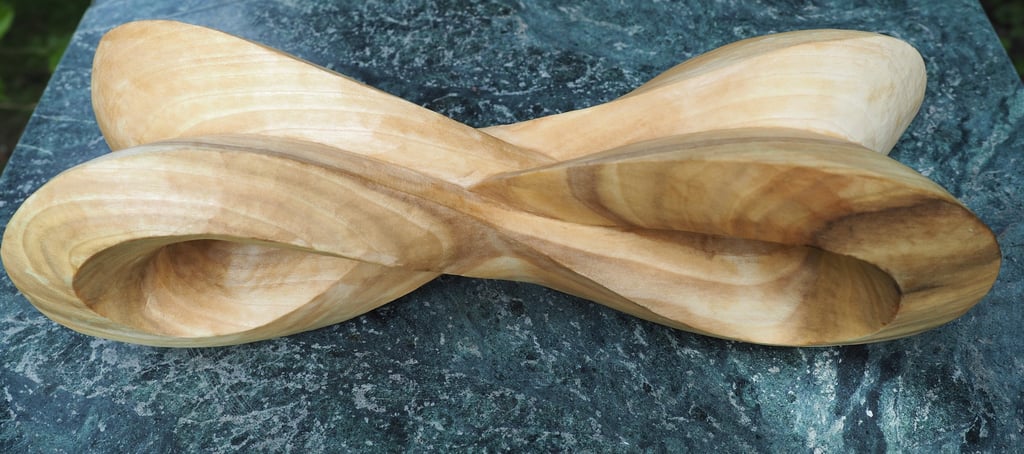 'Infinity Mobius' - abstract sculpture in tulip wood. by Sarah Liptrot