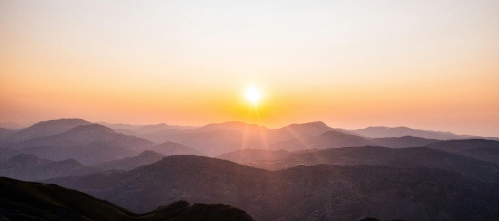Sunrise over mountains symbolising hope, healing, guidance and finding peace after difficulties