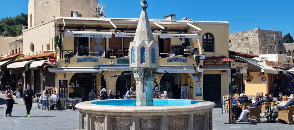 rhodes old town with a fountain in the middle of a square