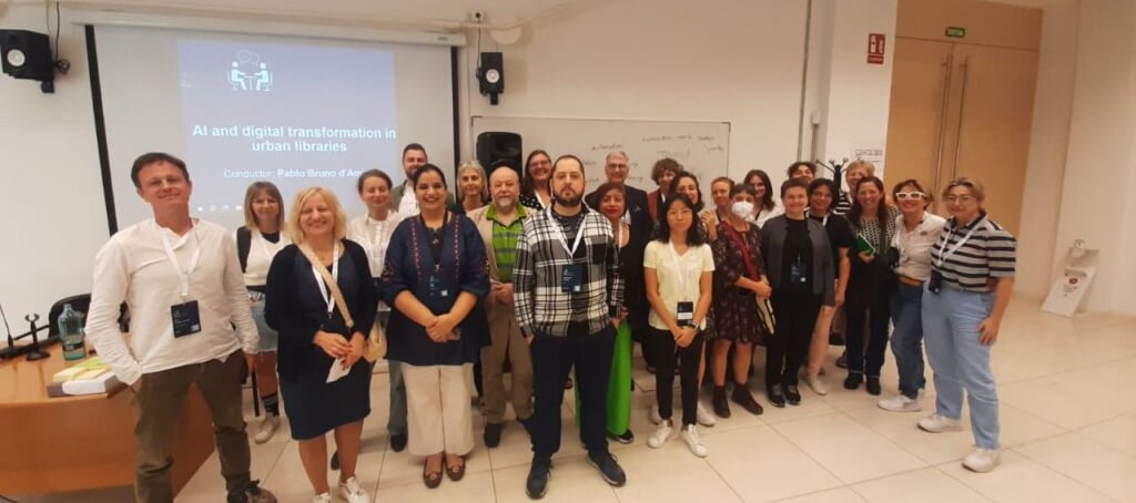 a group of people standing in front of a presentation