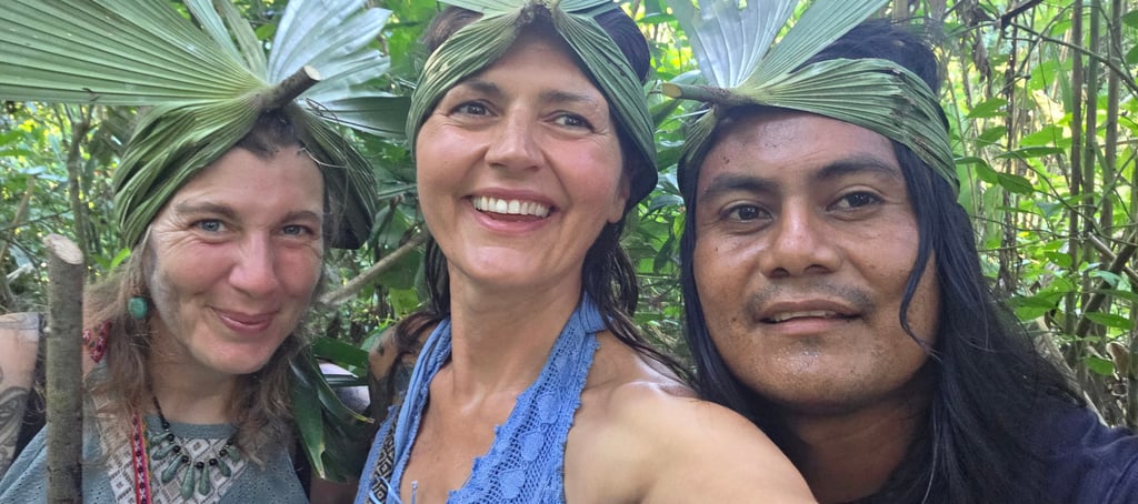 three people standing in front of a forest with jungle crowns