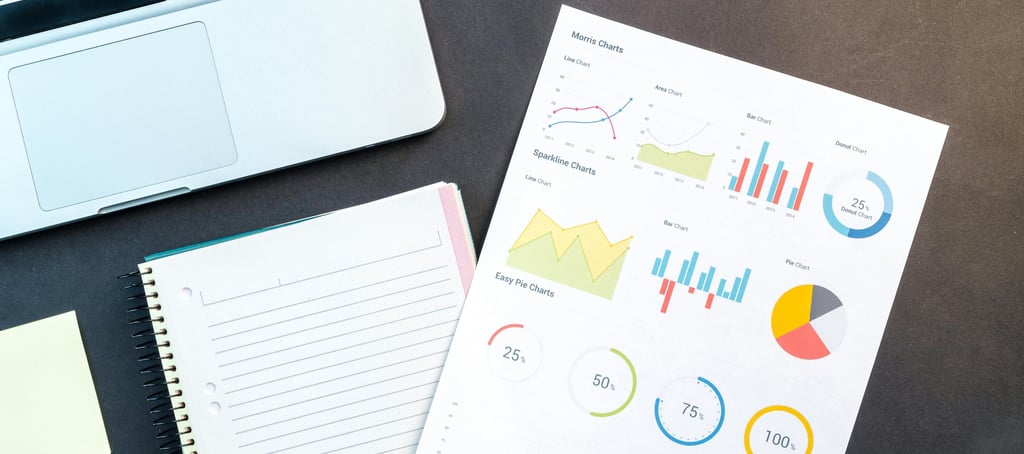 Laptop and documents on a desk