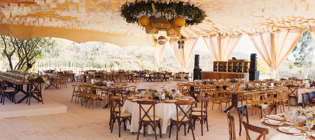 a large tent with tables and chairs and a table