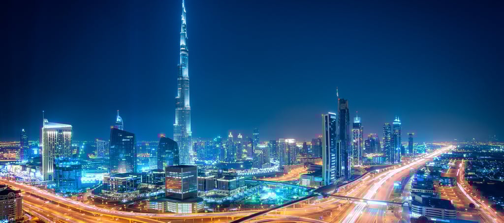The vibrant Dubai cityscape at night, a global hub for business and innovation.