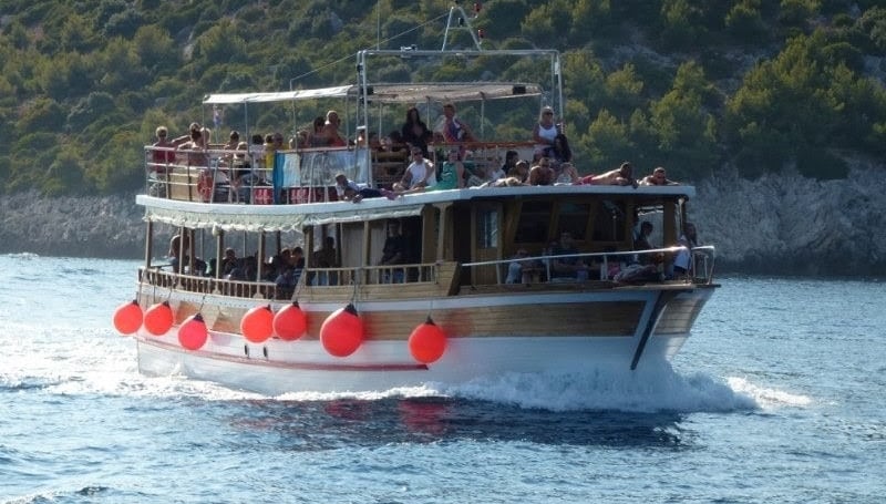 The picture shows tourists on a day trip boat.