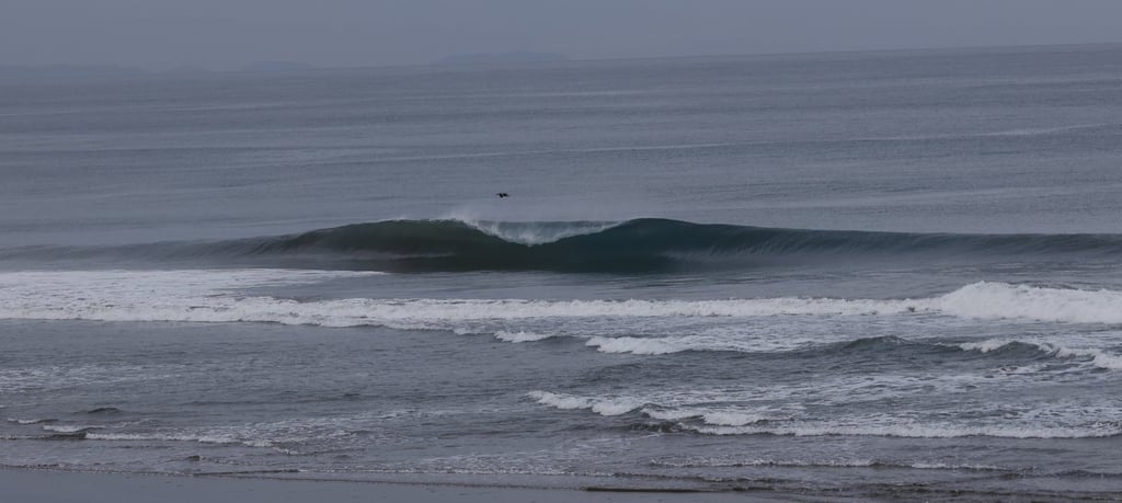 A lonely perfect wave breaking at an Ecuadorian Beachbreak