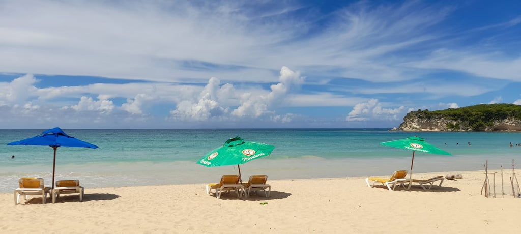 Macao Beach with turquoise water, soft sand, and Presidente umbrellas in the Dominican Republic