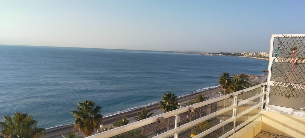 a balcony with a balcony and a view of the ocean