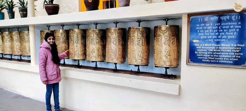 Tibetan prayer wheels at the Dalai Lama Temple in McLeod Ganj, Dharamshala, symbolizing peace, faith, and Buddhist tradition.