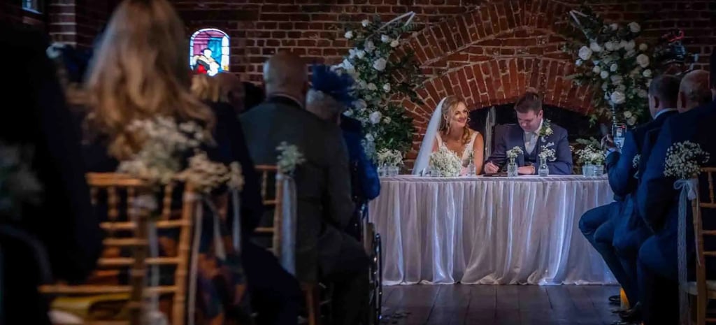 Wedding register signing at Tudor Barn Eltham