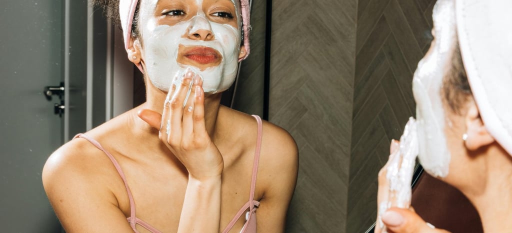 a woman with a towel on her face and a towel on her head