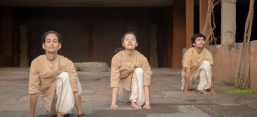 three people doing surya kriya