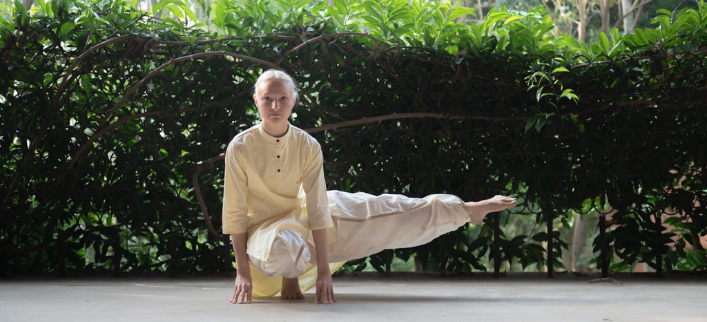 a girl is doing angamardana which very helpful for stress