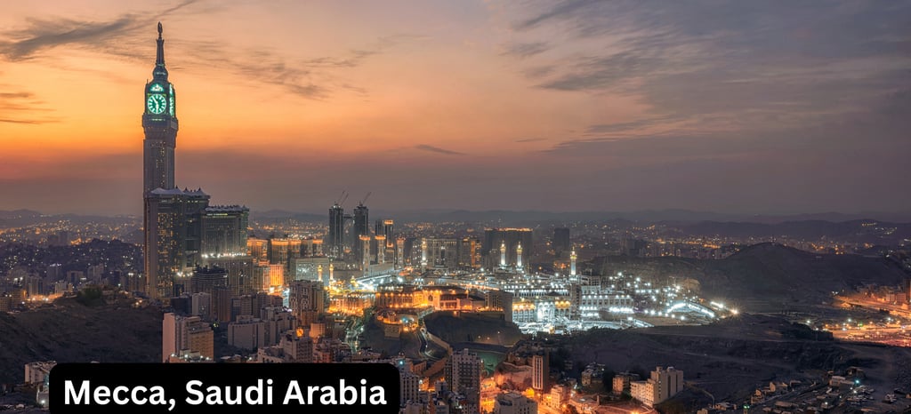 An expansive, high-angle panoramic view of Mecca, Saudi Arabia, at sunset or twilight. The Abraj Al-