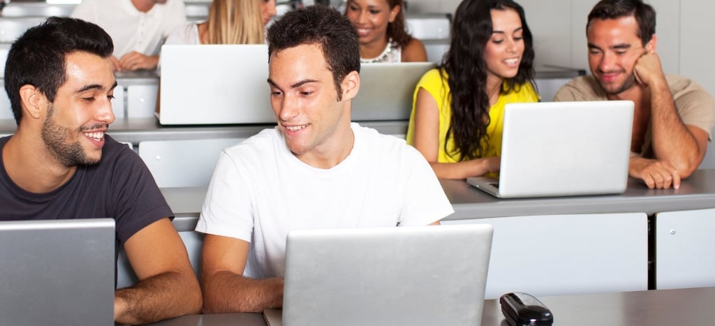 a group of people sitting at desks in a classroom-Ai-Integrated Digital Academy
